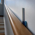 Close-up measuring handrail wall clearance