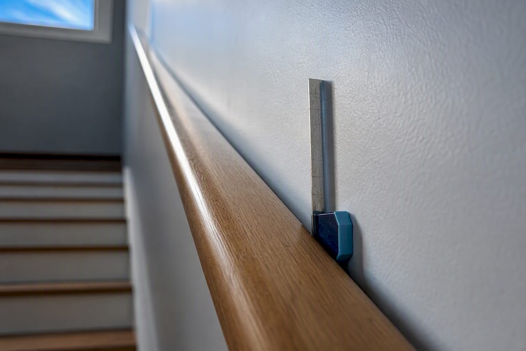 Close-up measuring handrail wall clearance