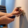 Handrail bracket secured with wall anchor