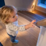 Child-height rail beside safe stair landing