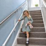 KiddieRail mounted below an adult stair handrail