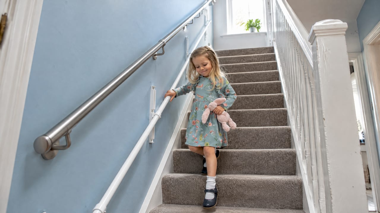 KiddieRail mounted below an adult stair handrail