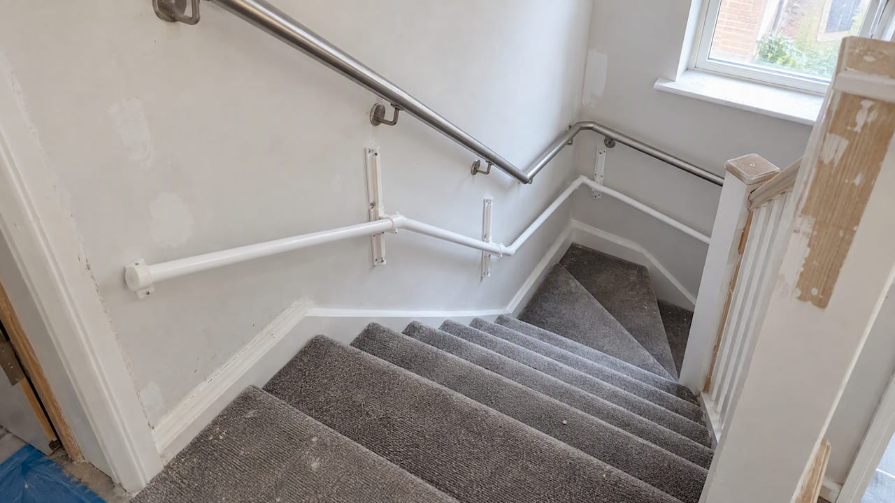 KiddieRail installed beside a home staircase