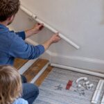 KiddieRail extension beside a child-height stair rail