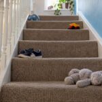 Toys and shoes scattered across stair treads